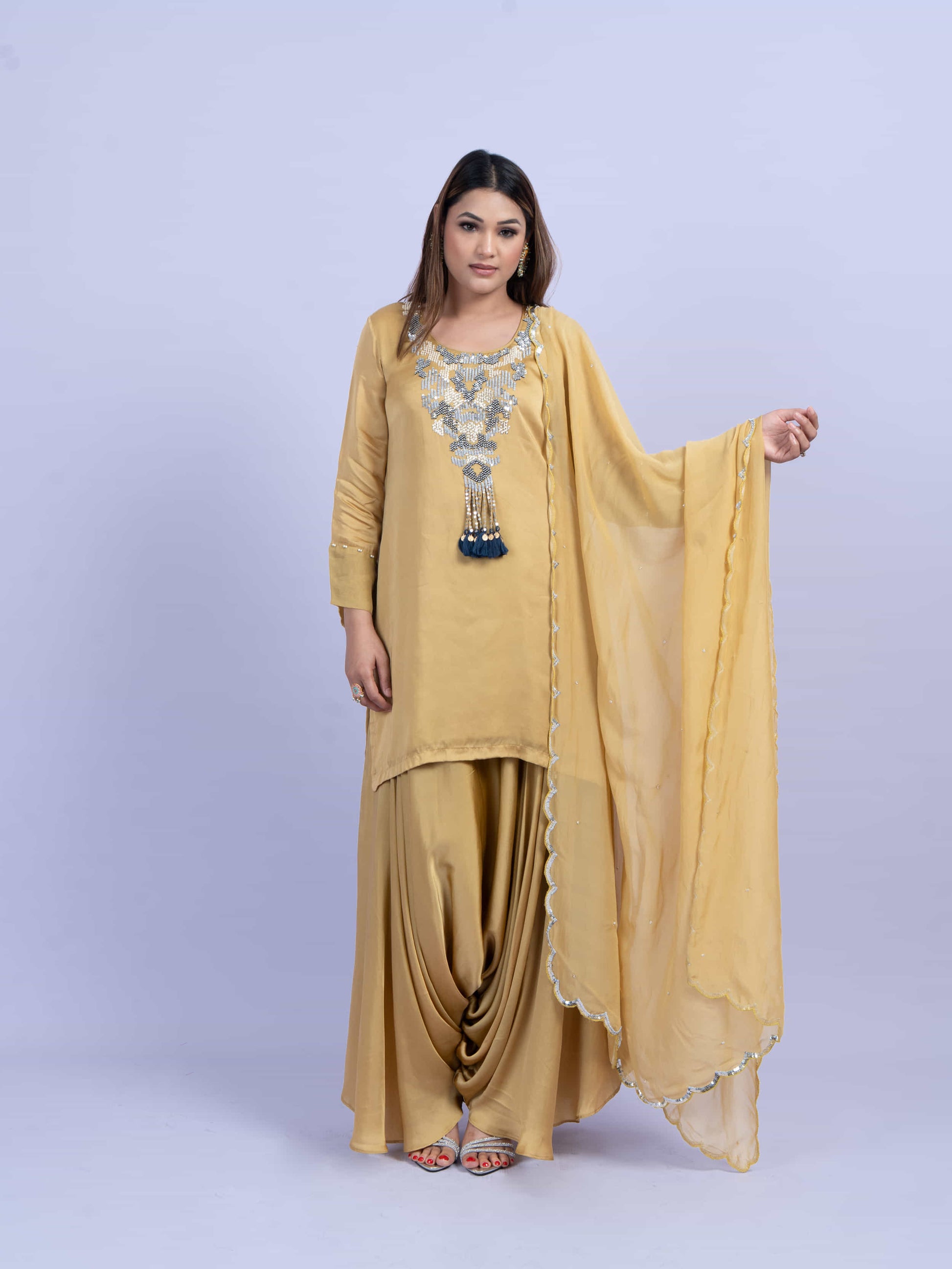 Mustard kurta set with embroidery on neck paired with dhoti pants and dupatta