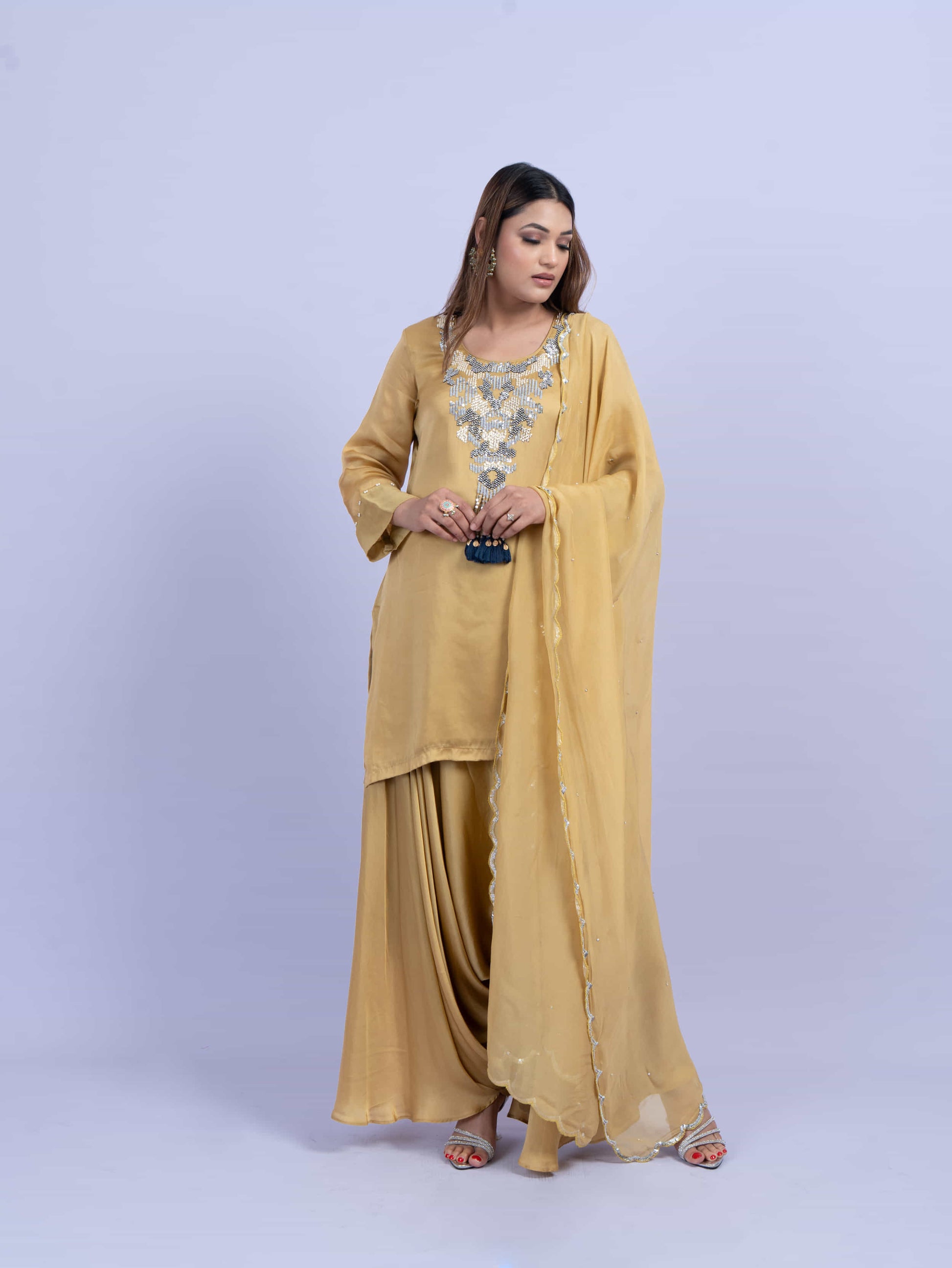 Mustard kurta set with embroidery on neck paired with dhoti pants and dupatta