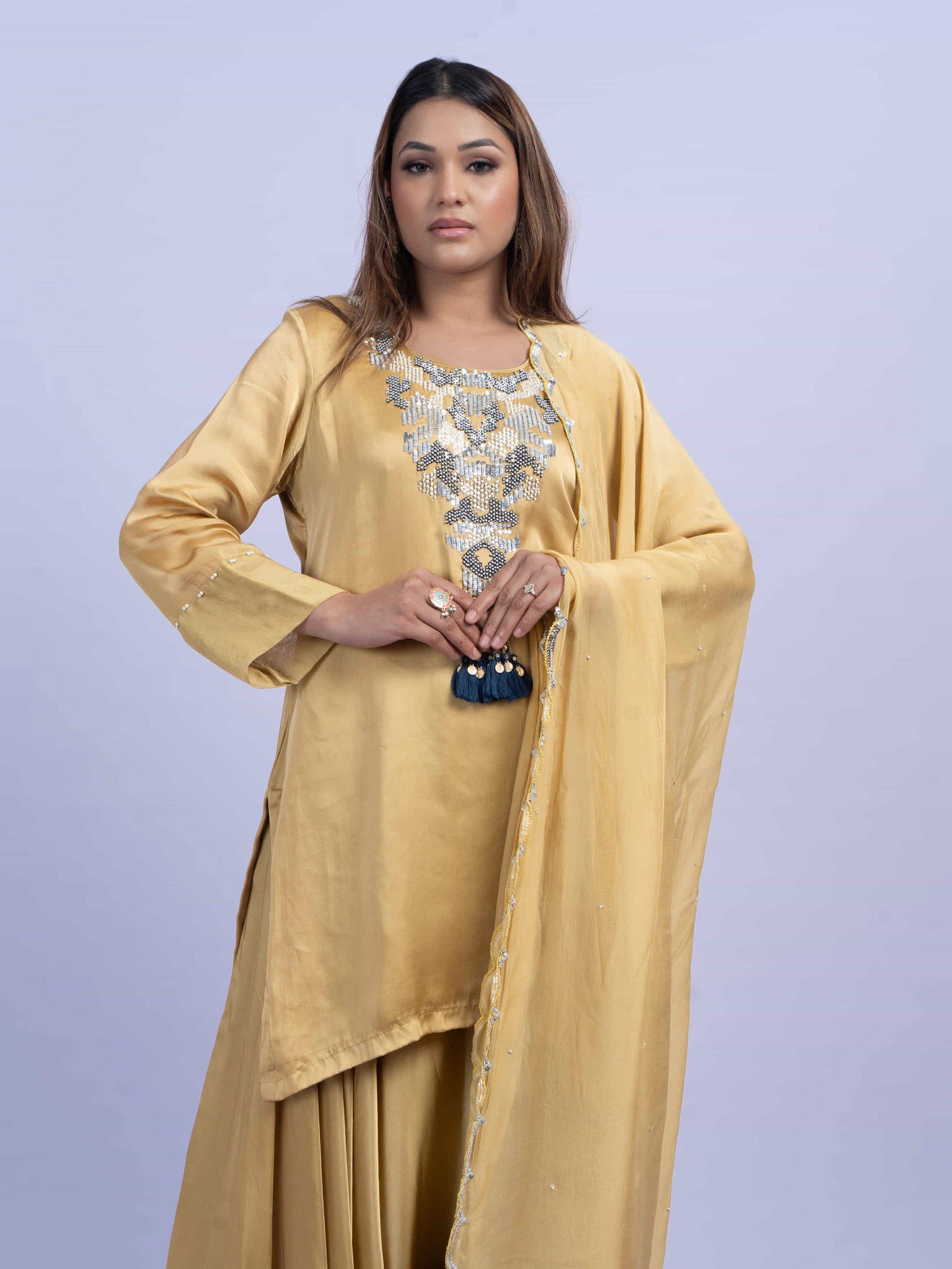Mustard kurta set with embroidery on neck paired with dhoti pants and dupatta