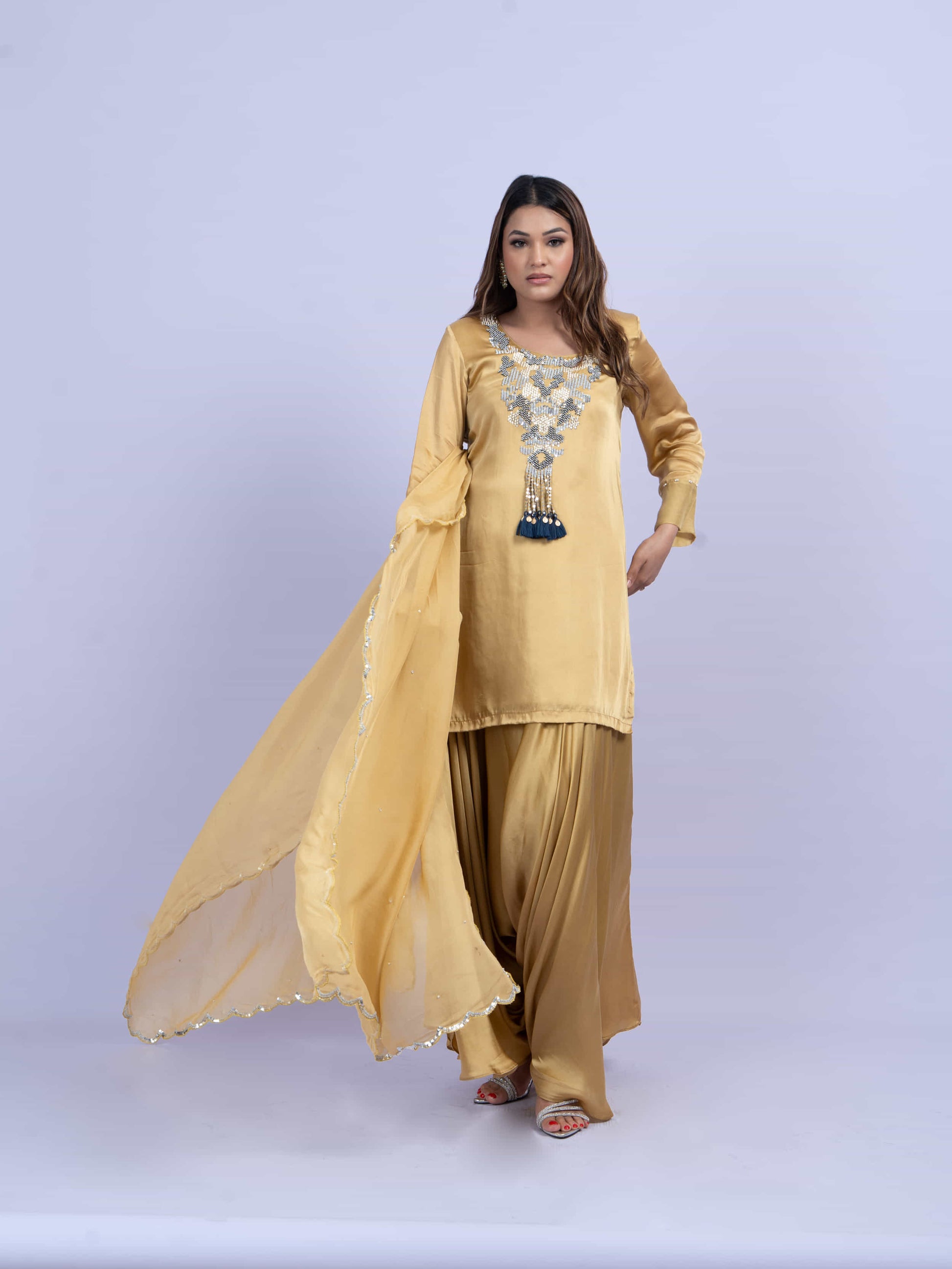 Mustard kurta set with embroidery on neck paired with dhoti pants and dupatta