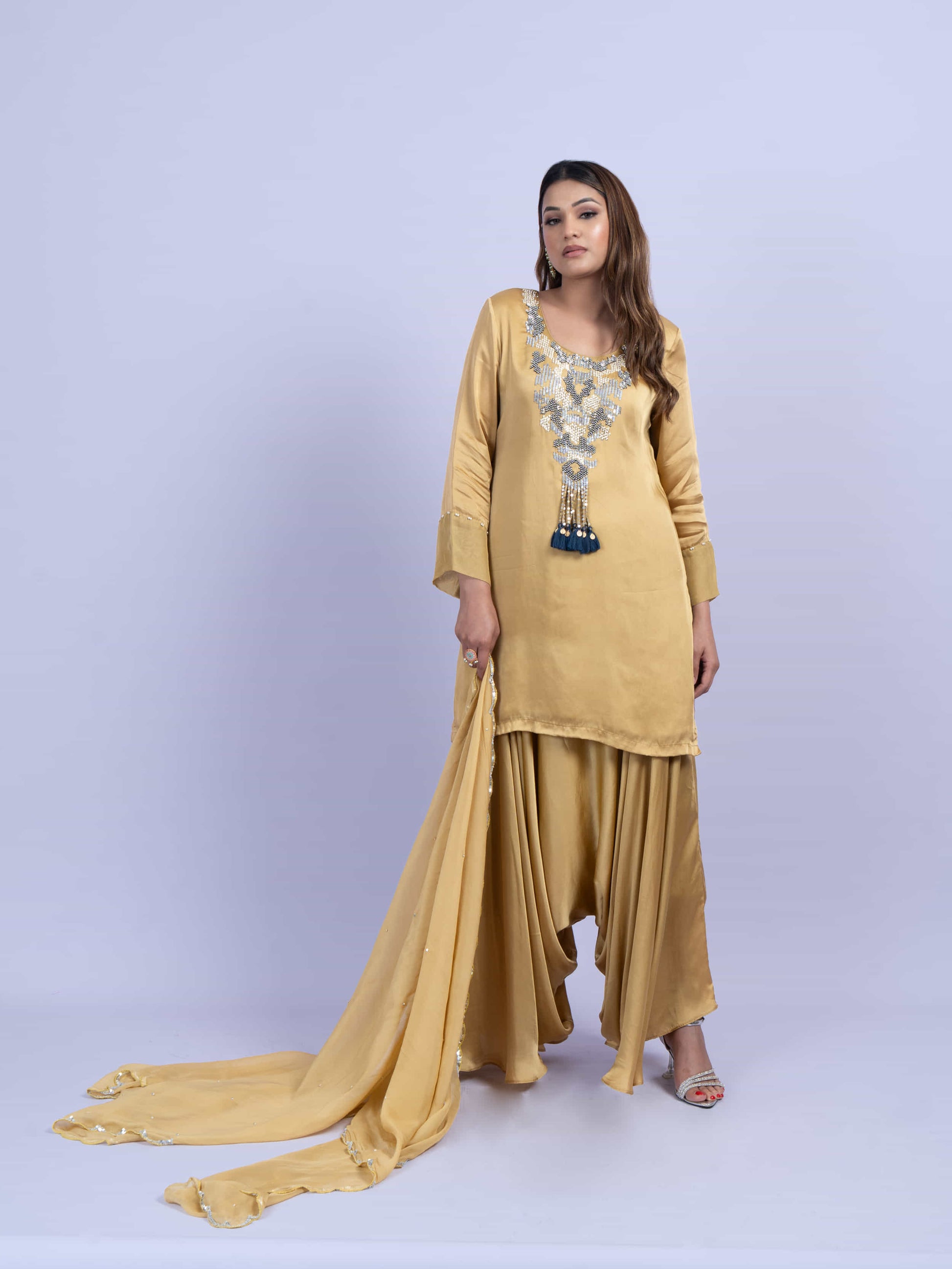Mustard kurta set with embroidery on neck paired with dhoti pants and dupatta