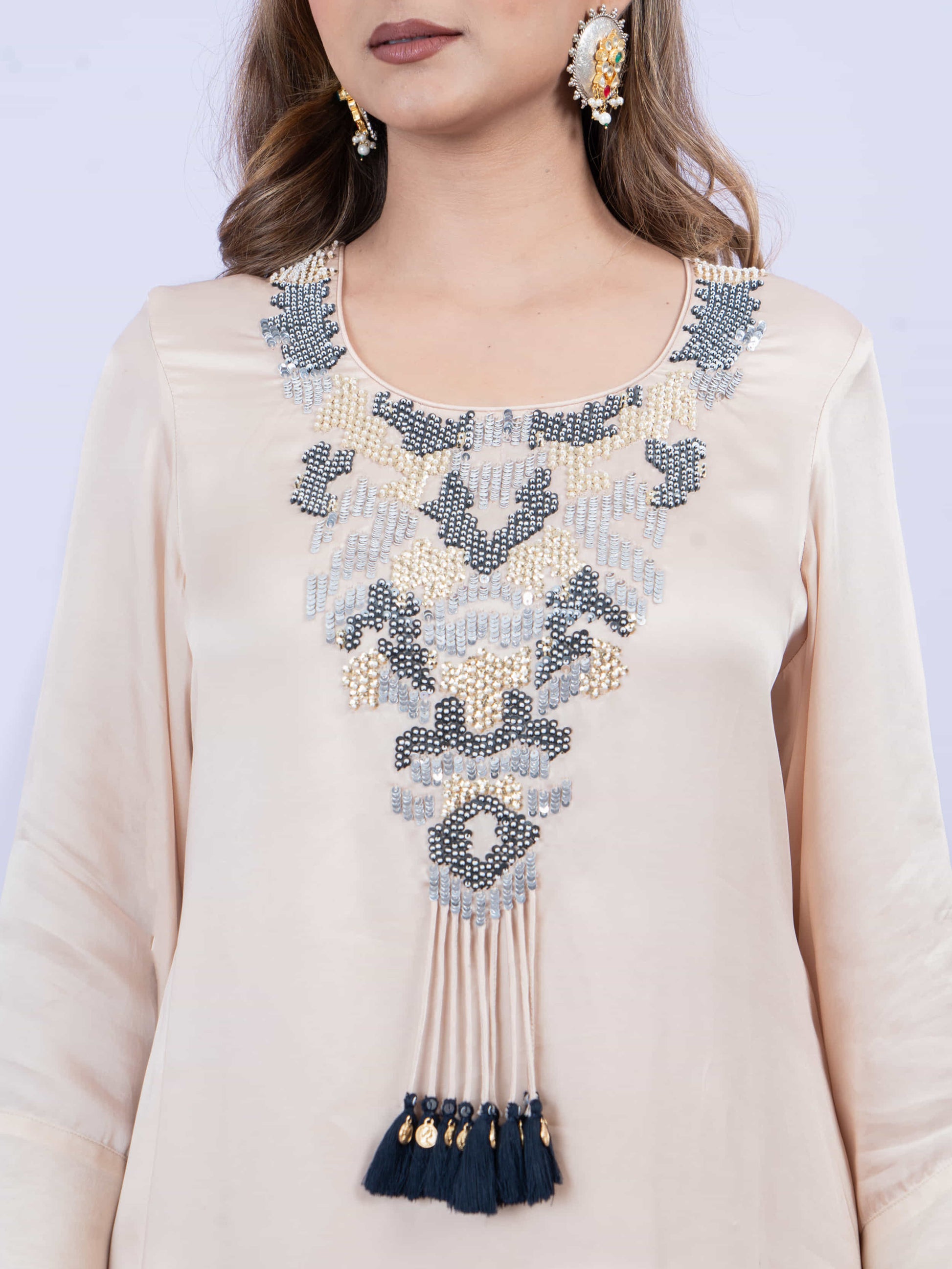 Ivory kurta set with embroidery on neck paired with dhoti pants and dupatta