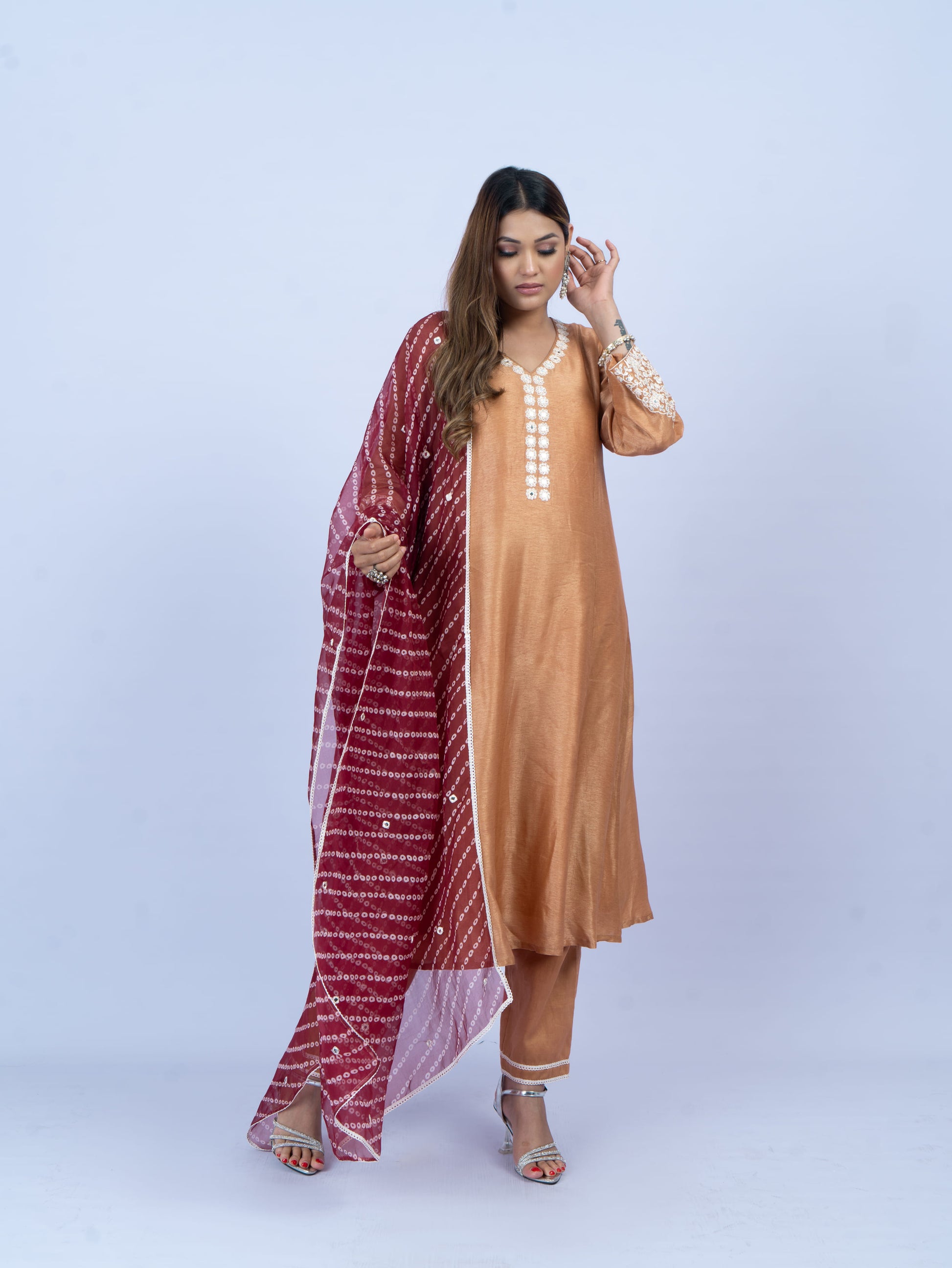 solid kurta set with hand embroidery on neck and sleeves paired with bandhni dupatta