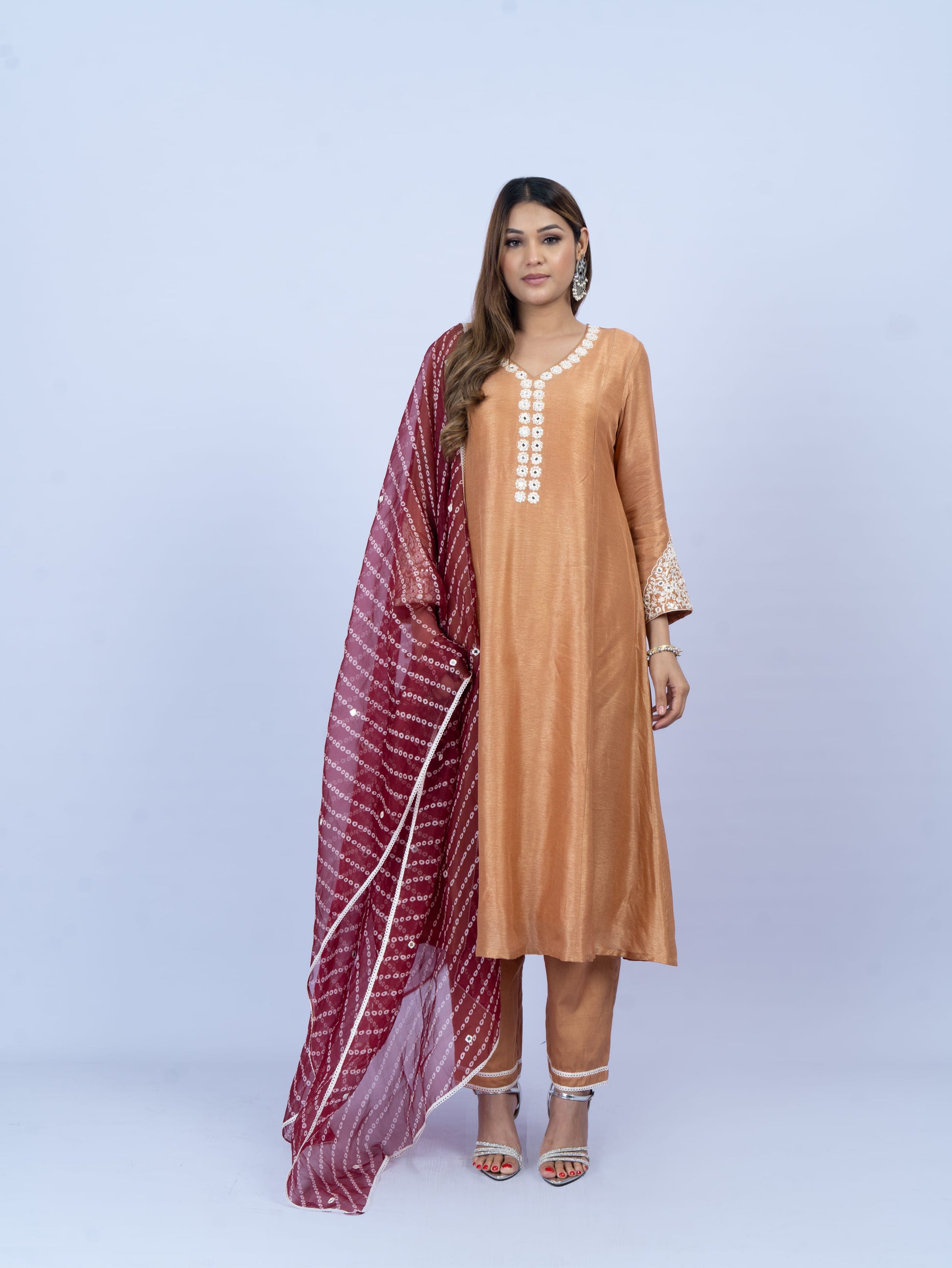 solid kurta set with hand embroidery on neck and sleeves paired with bandhni dupatta